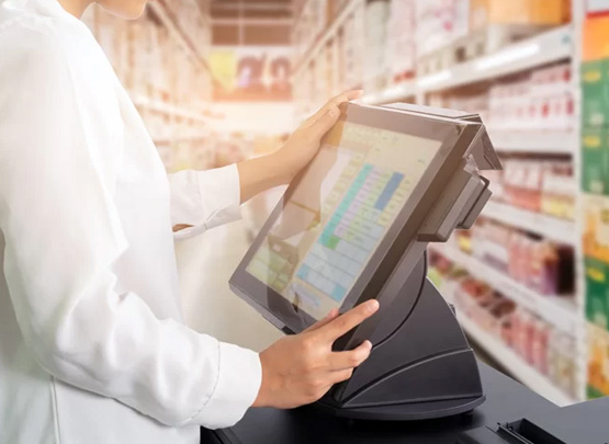 A salesperson uses a POS system