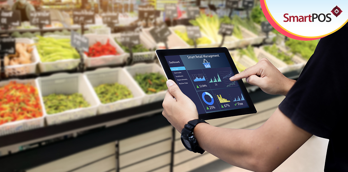 An employee using a grocery store inventory management software solution